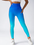Blue leggings with side slits worn by a person on a white background