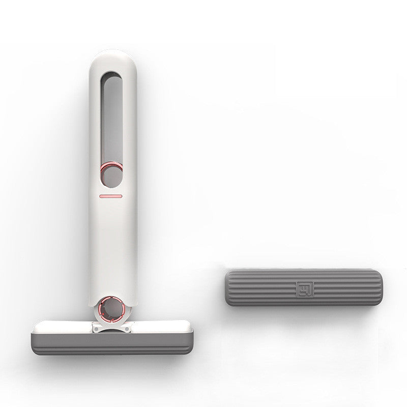 White handheld vacuum cleaner with gray attachment on a white background