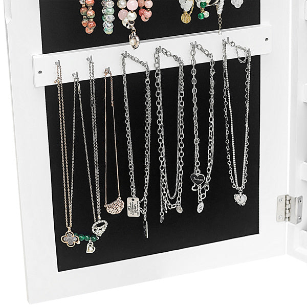 White jewelry cabinet with black interior displaying various necklaces.