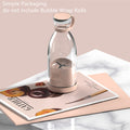 Clear Portable rechargeable USB blender with pink base on a magazine with text about packaging.