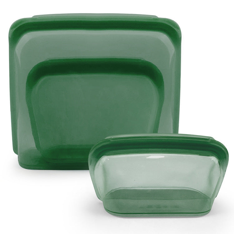 Set of green rectangular containers with lids on a white background