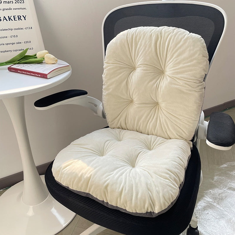 Beige chair cushion on a black office chair with a small table and tulips in the background; Ergonomic integrated office seat cushion with backrest in light gray viscose fabric