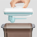 Close-up of the press-to-lock sealing mechanism on the formula container