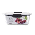 Clear glass food container with black handles and cherry design on a white background
