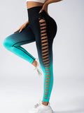Black and teal leggings with cut-out design on a white background