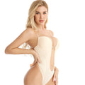Woman wearing a beige strapless bodysuit on a white background; Seamless jacquard one-piece tube top bra in skin color with detachable shoulder straps, designed for comfort and minimizing bust appearance