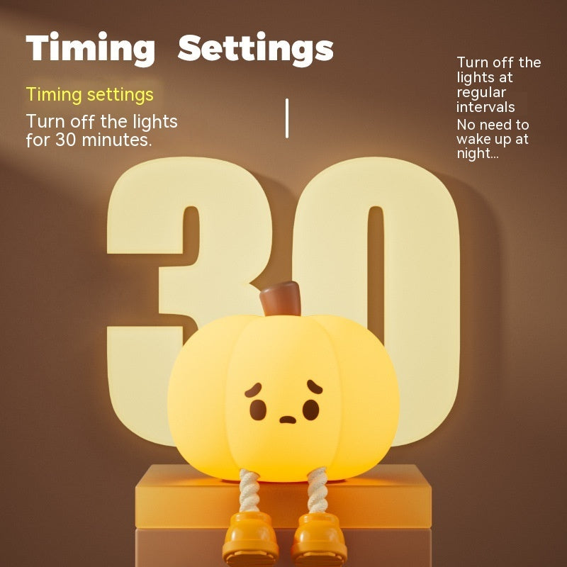 Pumpkin-shaped night light with a timer display on a brown background
