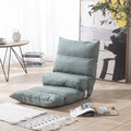 Green floor pillow on a wooden floor with a table and books in the background; Portable leisure chair for home and living room