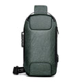 Green shoulder bag with USB ports on a white background; Men’s waterproof anti-theft USB shoulder sling bag in black Oxford cloth with single strap and multiple compartments for travel and daily use