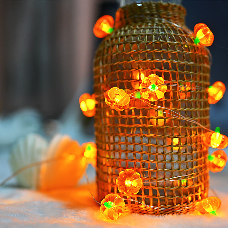 LED pumpkin string lights glowing in warm white for Halloween décor