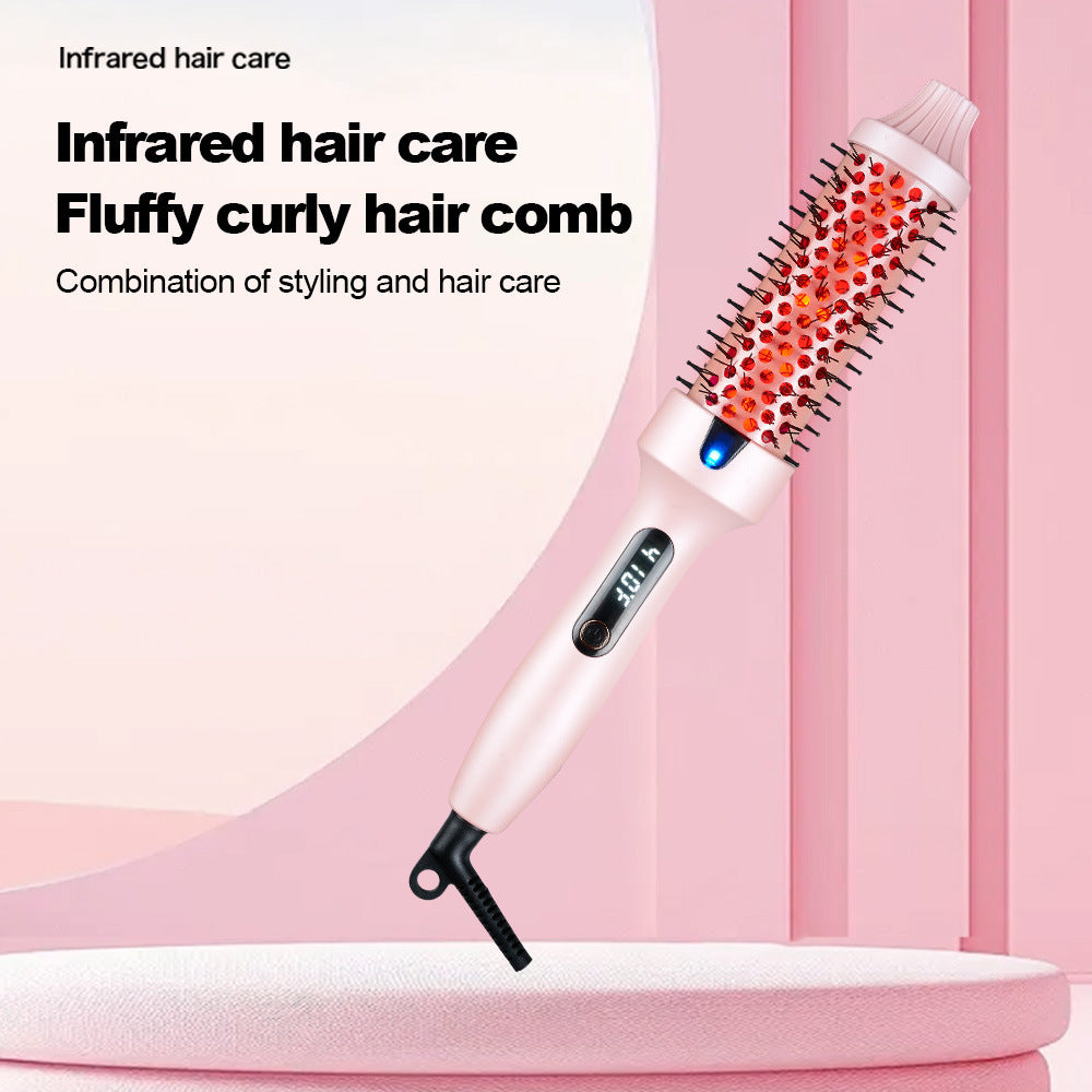 Infrared hair care comb with heating element on a pink background
