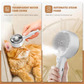 Pet grooming steam brush with transparent water tank cover and automatic steam pause feature, used on a cat